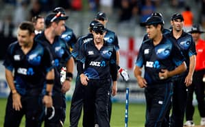 Captain McCullum of New Zealand walks off with his team after losing to England during the final cricket match of their one day international series at Eden Park